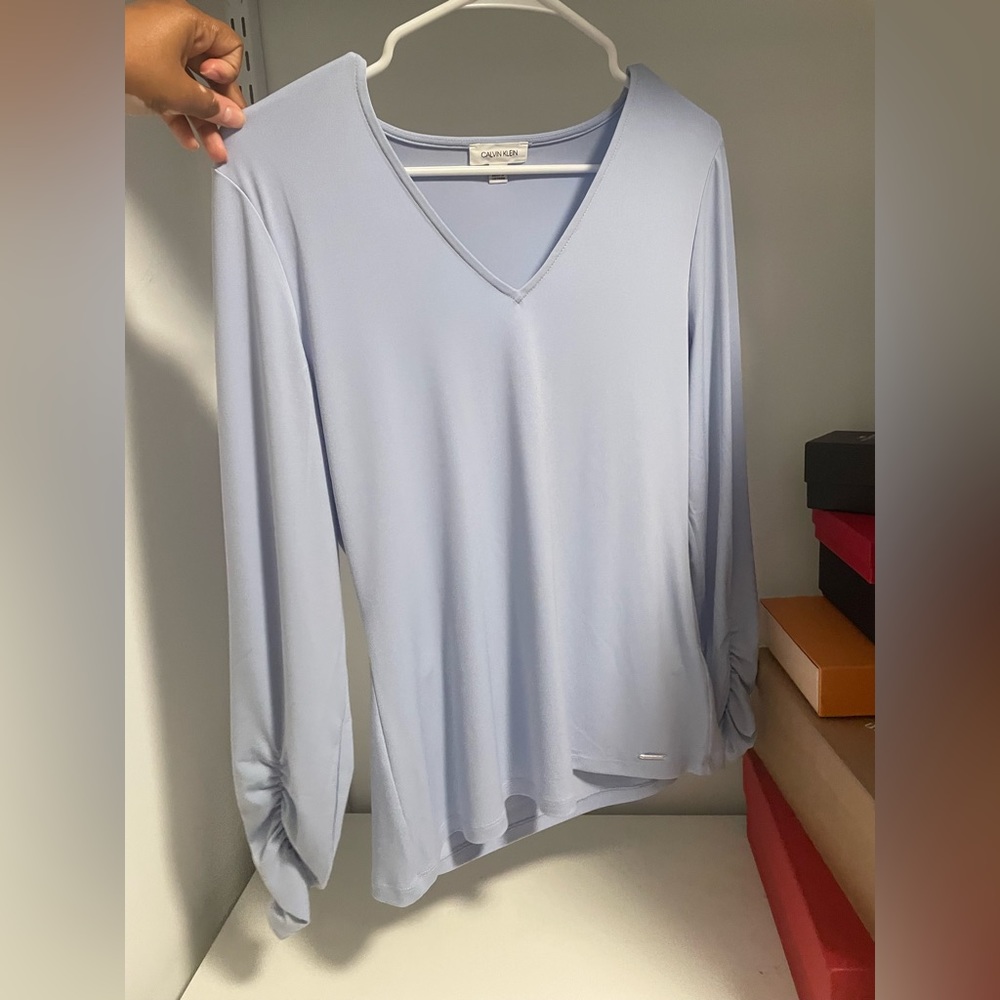 Calvin Klein light blue long sleeve top. Size M